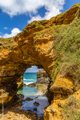 Natural archway and rock formation The Grotto showcase the vibrant coastline, with clear waters and rugged cliffs, perfect for exploring the beauty of Australia's landscape