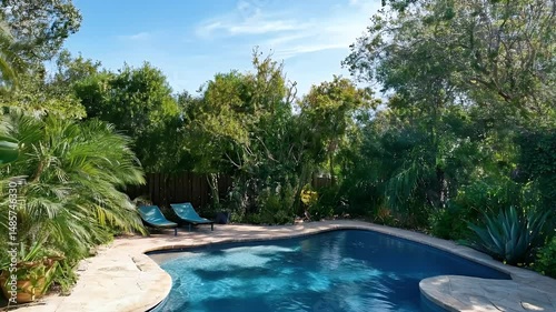 Wallpaper Mural Clear Blue Swimming Pool Surrounded by Lush Green Garden Trees Under Bright Sky Torontodigital.ca