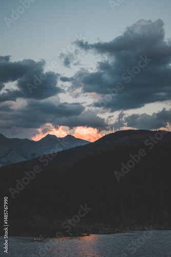 dramatic sunset panorama view on a summer day in jasper national park, canada, with moody sky and rocky mountains background