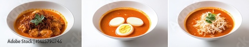 Three bowls of a reddish-orange curry-like dish, with variations photo