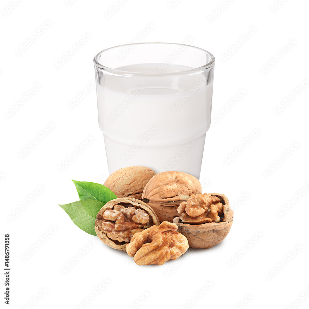 Nut milk in glass and walnuts isolated on white Nut milk in glass and walnuts isolated on white