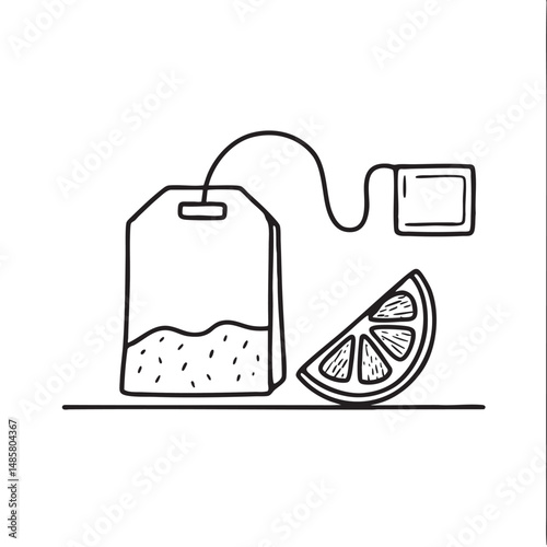 A tea bag beside a lemon slice on top table
