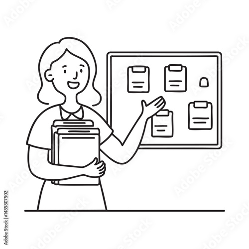 A teacher arranging folders beside a bulletin board