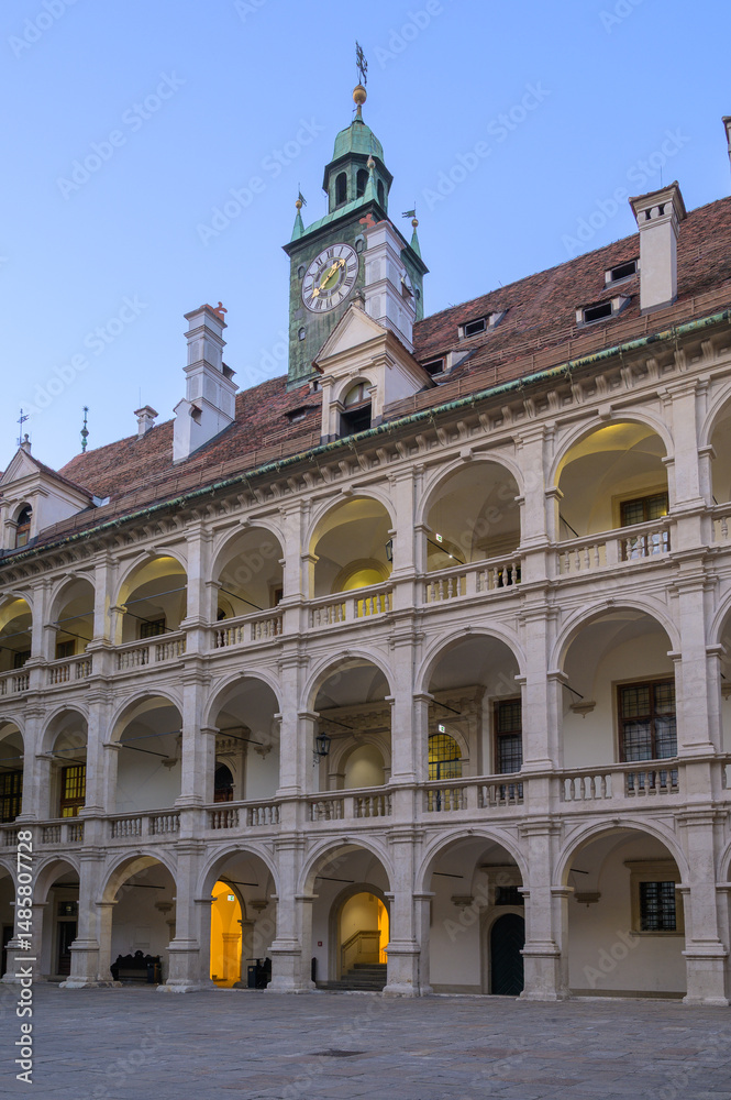 Fototapeta premium Historic courtyard features beautiful architecture in Graz Austria at twilight