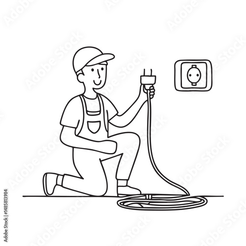 Male technician kneeling beside a wall socket with cables