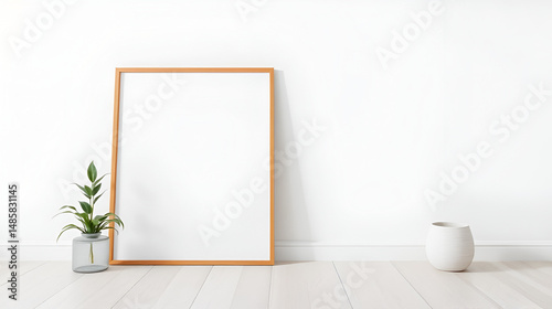 An empty frame leans against a bright wall in a minimalist space, complimented by plant decor for elegance.
