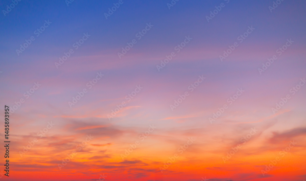 Obraz premium colorful clouds and sky,Dusk, Sunset Sky Clouds in the Evening with colorful Orange, Yellow, Pink and red sunlight and Dramatic storm clouds on Twilight sky, Landscape horizon