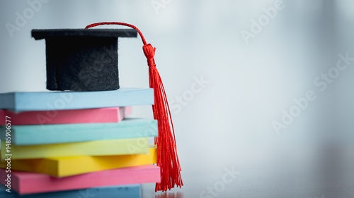 Graduation cap on stack of ...
