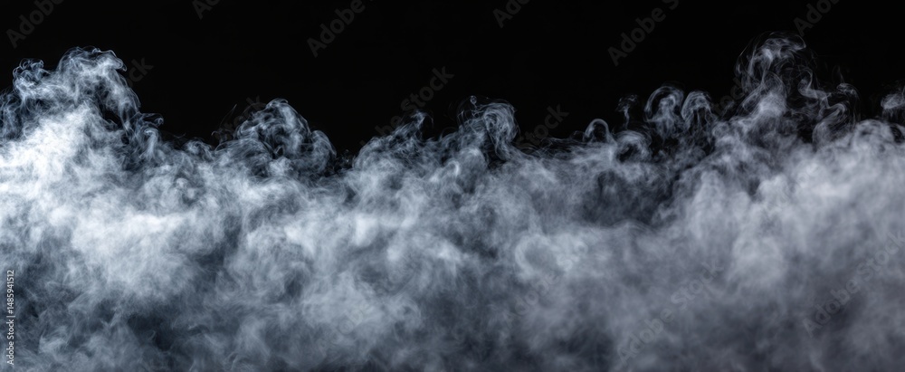 Fototapeta premium The swirling smoke creating an ethereal atmosphere against a dark background.