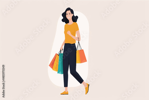 Smiling woman walking and holding shopping bags