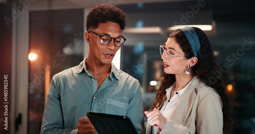 Business, people and tablet with discussion in office for investment news, explain currency price or research. Trader, teamwork or overtime with digital app for trading portfolio or deadline at night