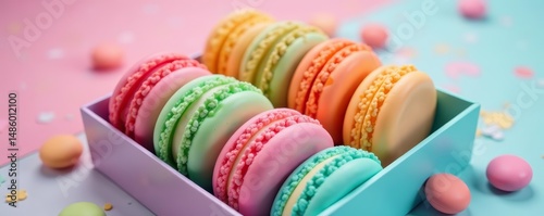 Colorful macaron box against swirled pastel hues, treats, delicious, cute