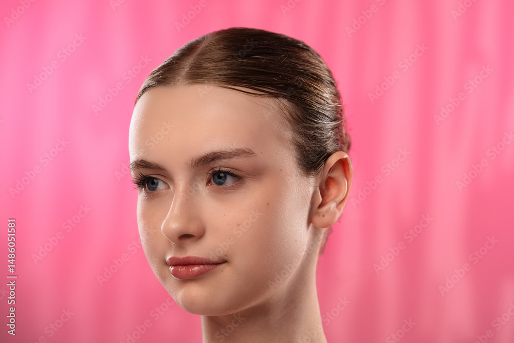 Fototapeta premium Young Woman with Clear Radiant Face Smiling Gently for Skincare