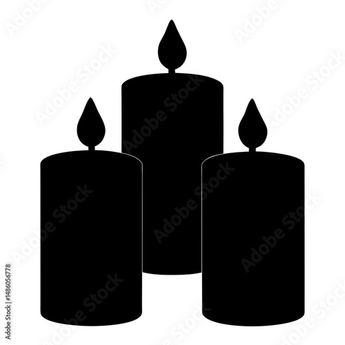 Three burning candles in silhouette creating a solemn and peaceful scene