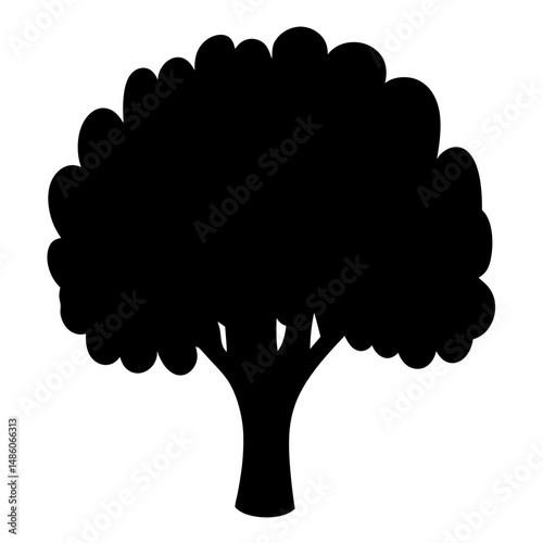 Isolated silhouette of a full, bushy tree with a thick trunk