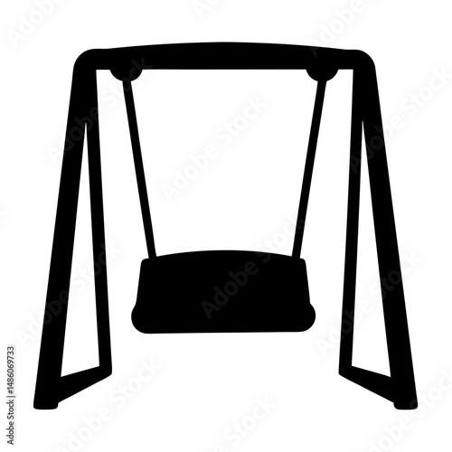 Silhouette of a swing set on a playground for children's recreation