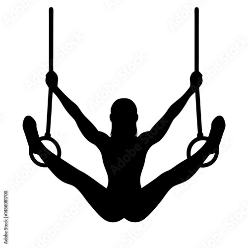 Gymnast performing a ring split in silhouette with arms outstretched position