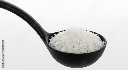 Close-up of Cooked White Rice in a Black Ladle