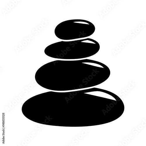 Black stones stacked in a balanced arrangement, symbolizing zen and wellness
