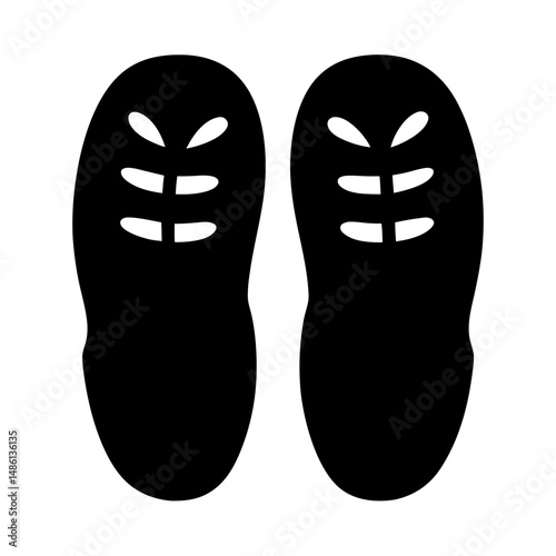 Graphic representation of black slippers or shoes with cut out detail