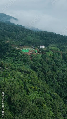 4K Vertical Drone Footage of Mountain Villa Construction Threatening Natural Forest 
