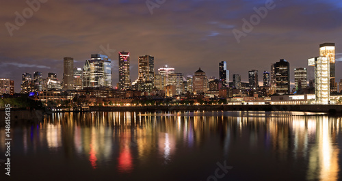 Montreal skyline at night with nice reflections in the St. Lawrence River