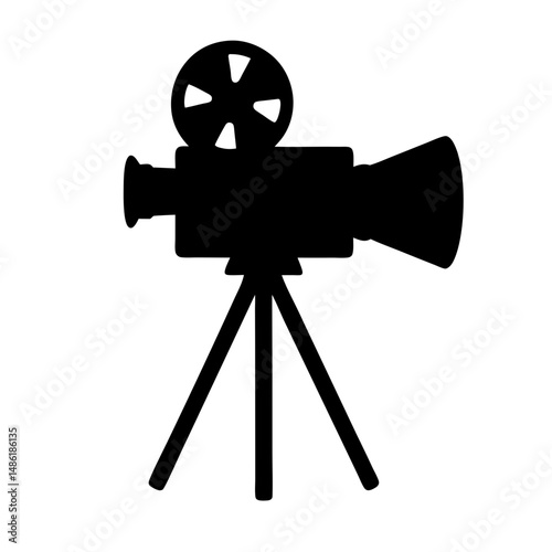 Silhouette of vintage movie camera on tripod, a classic cinema icon