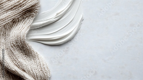 Pale Grey Abstract Background with White Cream Swirl and Beige Knitted Fabric