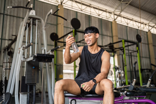 Fitness: Enjoying Water After Workout in Gym photo
