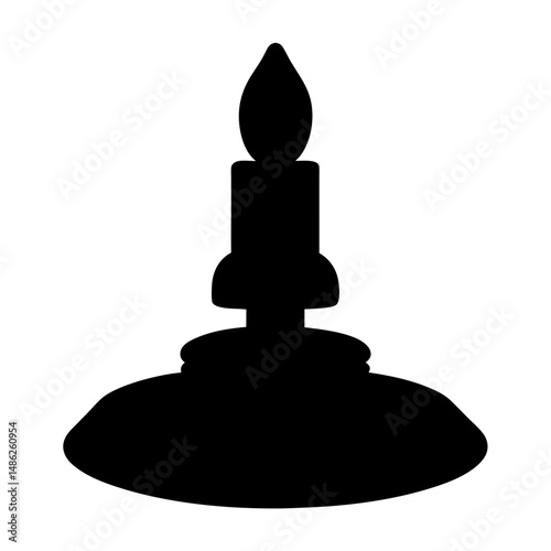 Black silhouette of a candle with a flame on a candlestick holder