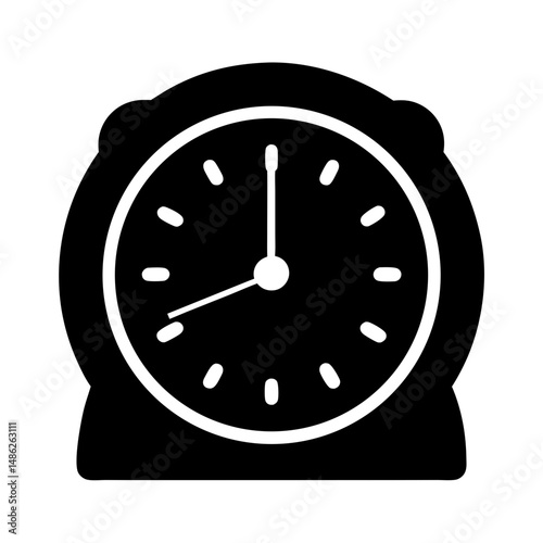 Silhouette of a classic bedside alarm clock showing ten minutes to twelve
