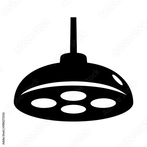 Black and white surgical light shines for medical procedures and operations