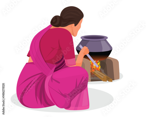 Indian woman cooking food in traditional way. Rural Indian Woman cooking food in the Kitchen using firewood stove