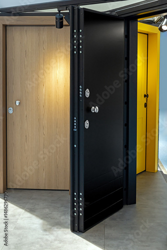 Selection of modern security interior entrance doors inside showroom