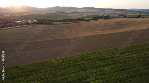 Aerial view of the stunning Moravian countryside, showcasing vibrant green and brown rolling fields with abstract patterns