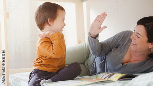 A mother and child are playing together