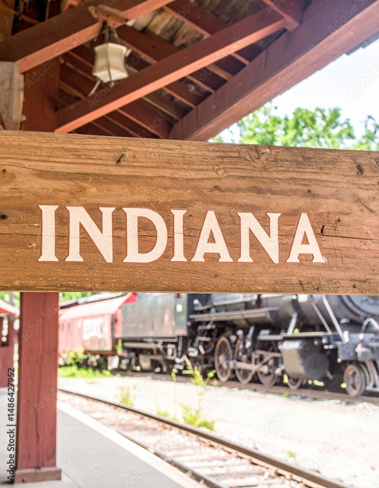 Fototapeta premium Vintage train station in indiana with historical locomotive and wooden signage
