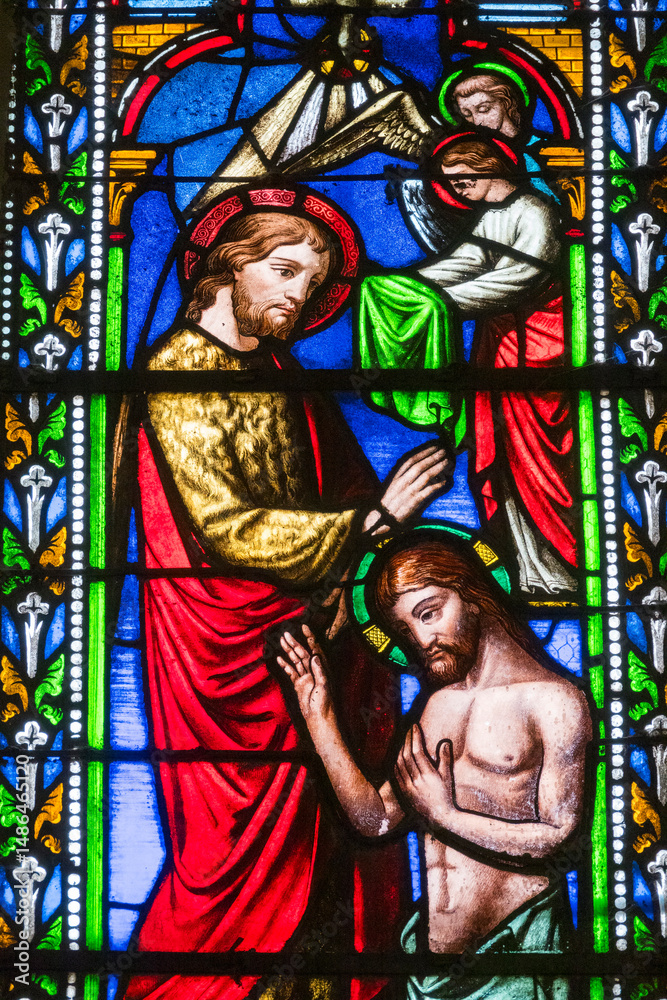 Fototapeta premium Stained glass (19th century) of Baptism of Jesus by John the Baptist in the Jordan river.
