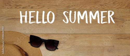 Summer Essentials with Hat and Sunglasses on Wooden Background