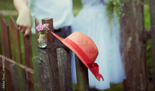 red hat on a wooden fence