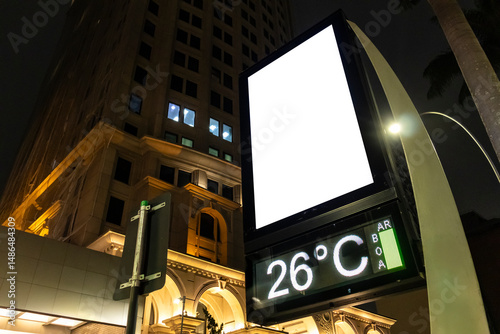Billboard blank mock up on a digital street clock in the city of Sao Paulo. Use this photo day mockup for your outdoor design.