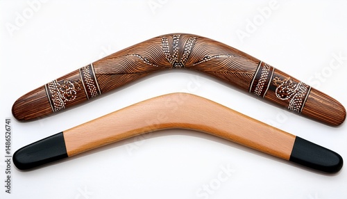 two wooden australian boomerangs on white