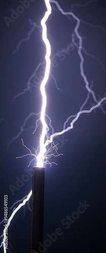 lightning bolt hitting through the night sky