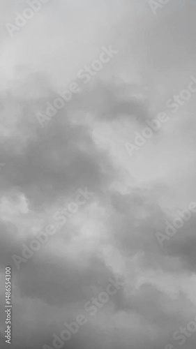 vertical video of Grey and moody storm clouds moving across the sky, time lapse