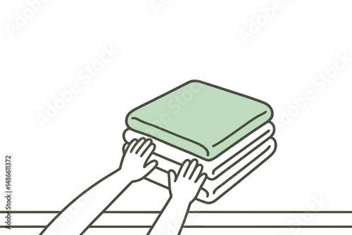 Hands arranging stacked towels in a minimalist setting  