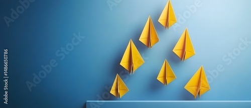 Yellow Paper Airplanes Flying Formation Blue Background