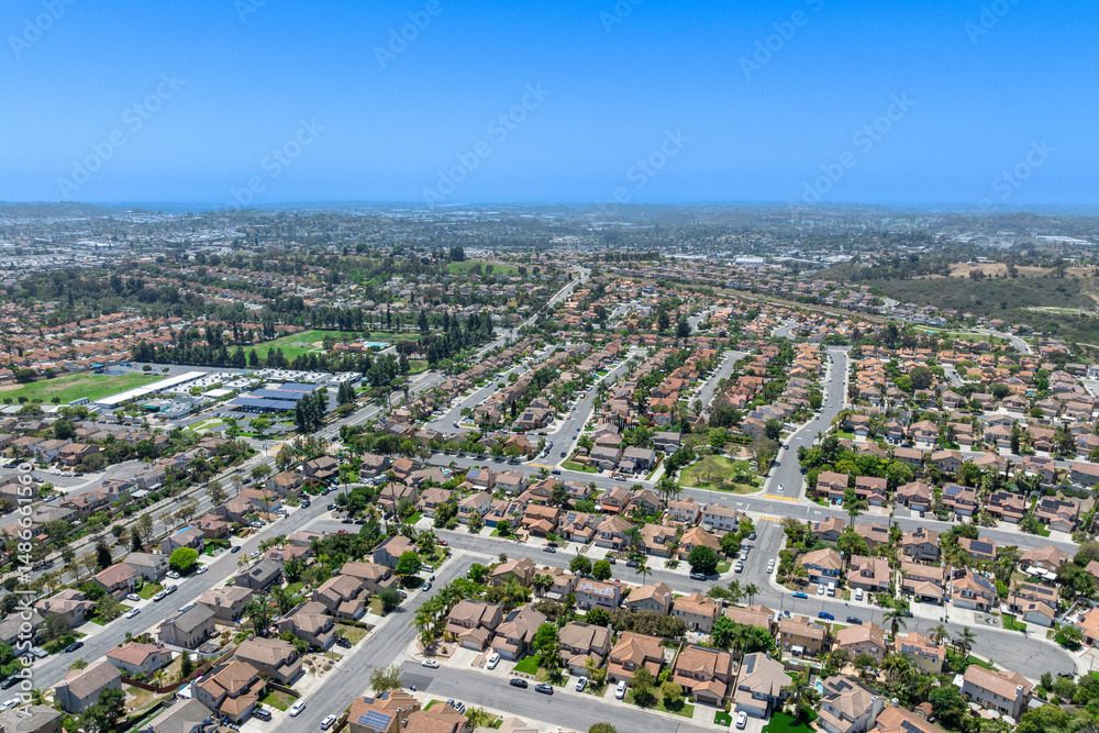 Fototapeta premium Aerial view of San Marcos neighborhood with houses and street during sunny day, South California, USA.
