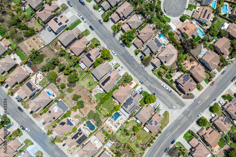Aerial view of San Marcos neighborhood with houses and street during sunny day, South California, USA. Aerial view of San Marcos neighborhood with houses and street during sunny day, South California, USA.