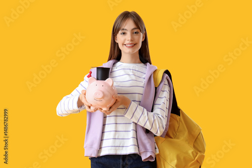 Female student with piggy b...