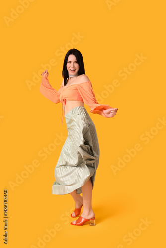 Happy young woman in skirt ...